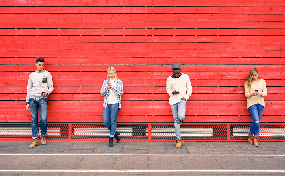 A photo of people, holding phones