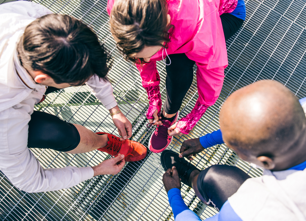 Runners tying shoelaces