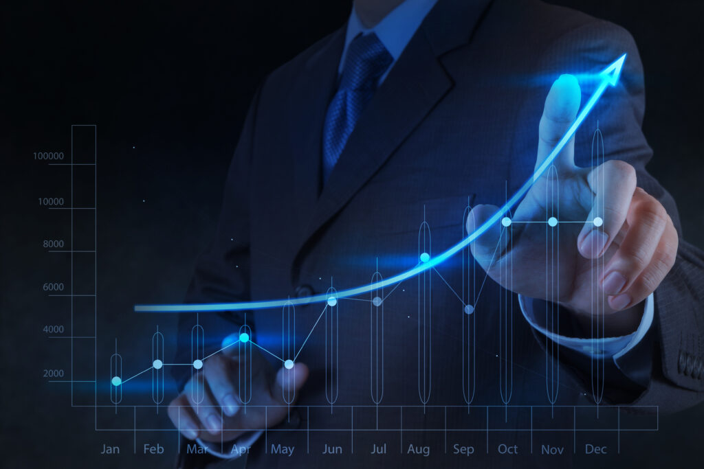 A growing chart with a man's hand