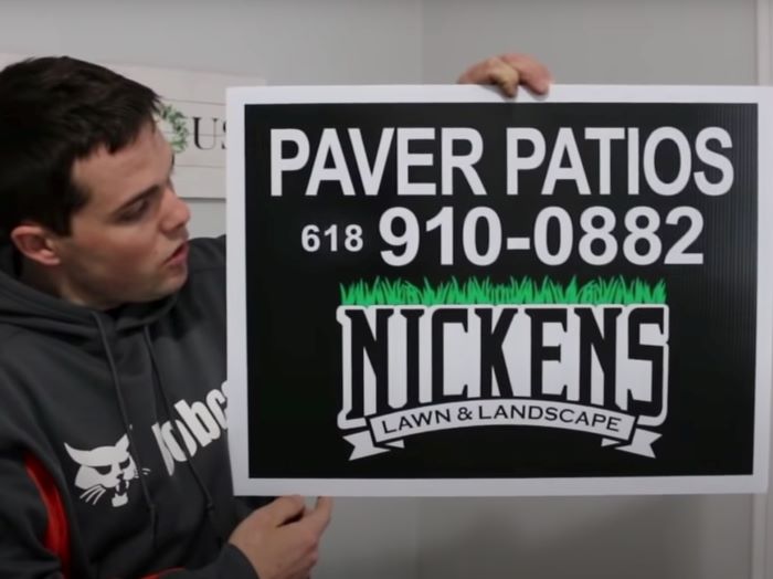 A sample of a sign of the company Nickens lawn&landscape